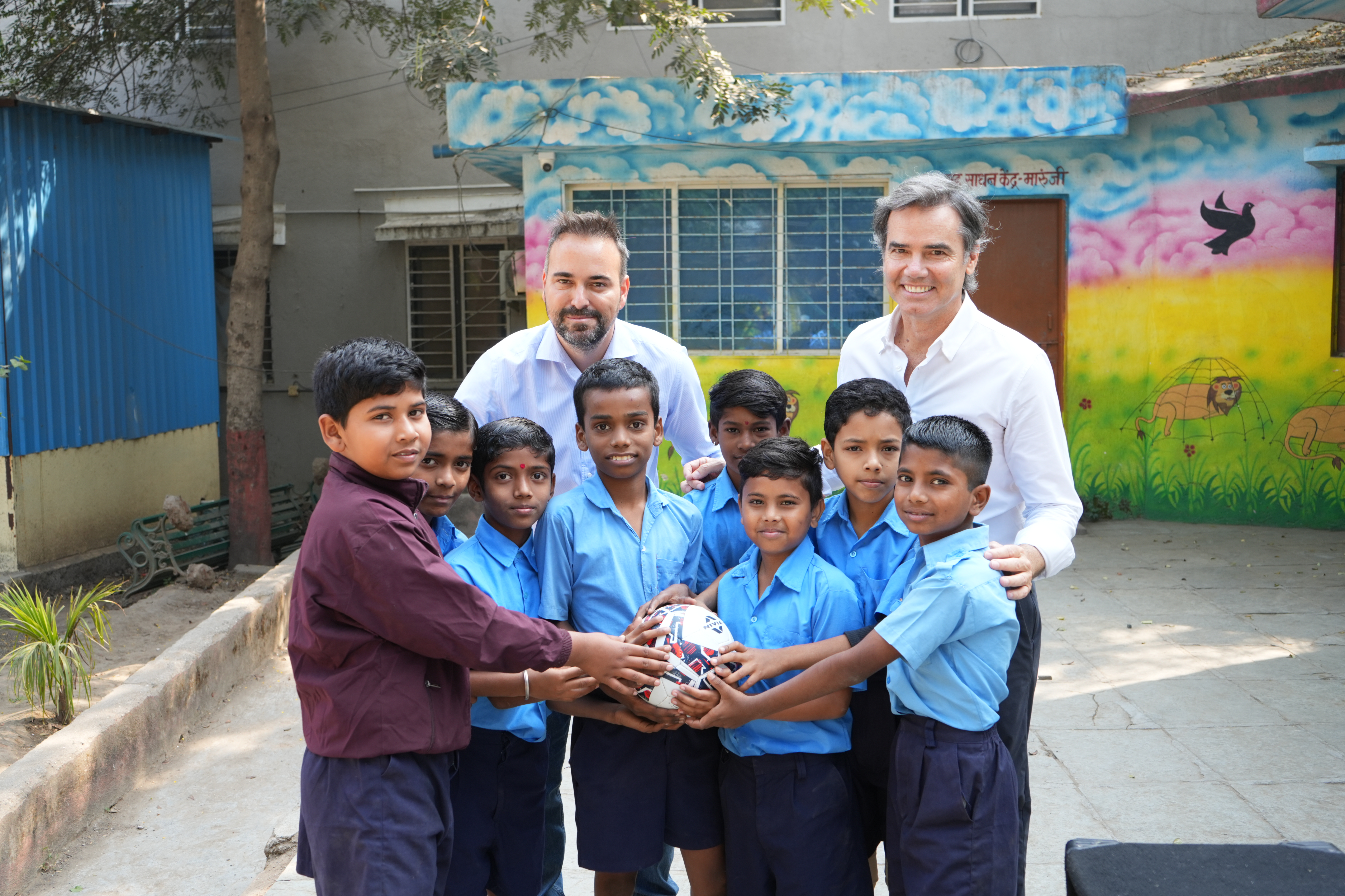 MATE coaches with school kids